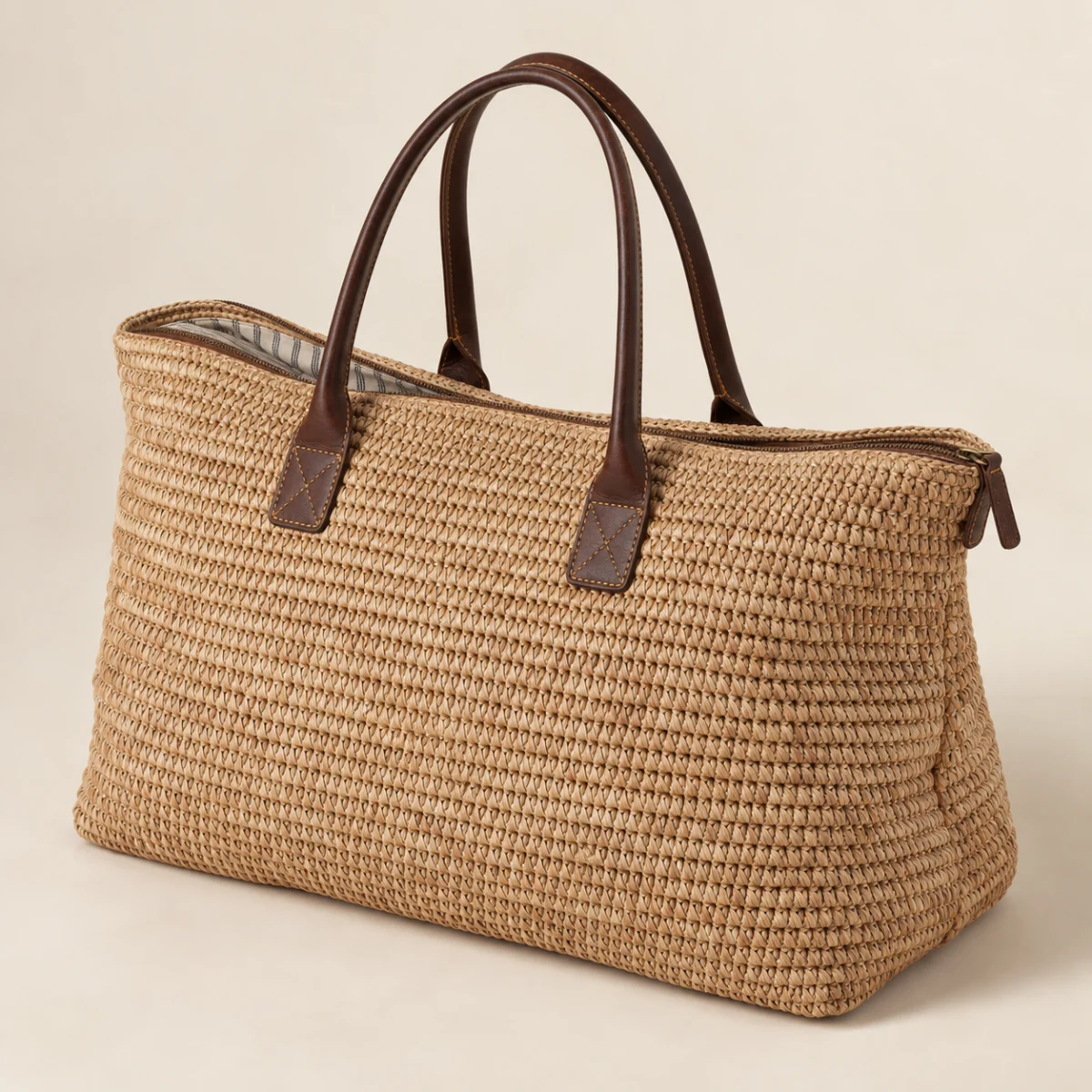 Illustrative woven weekender bag with reinforced carry handles